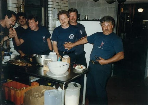 Detroit Firefighters having a good time in the firehouse kitchen